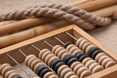 old wooden abacus on the background of baggingの写真素材