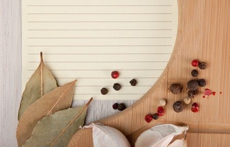 blank sheet for cooking recipes and spices on the kitchen tableの写真素材