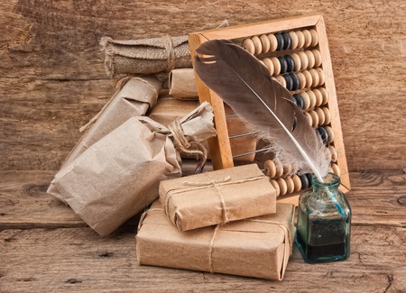 pile parcel wrapped with brown kraft paper and abacusの写真素材