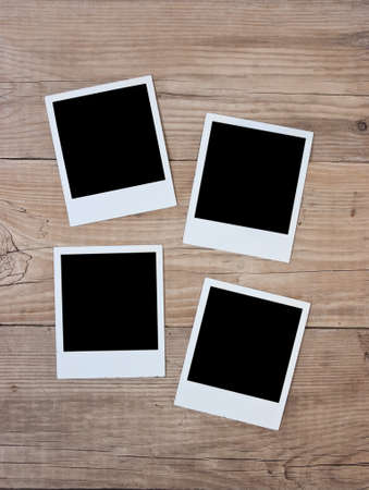 old photos on wooden wall の写真素材