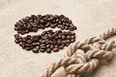 coffee beans and rope knot on sackの写真素材