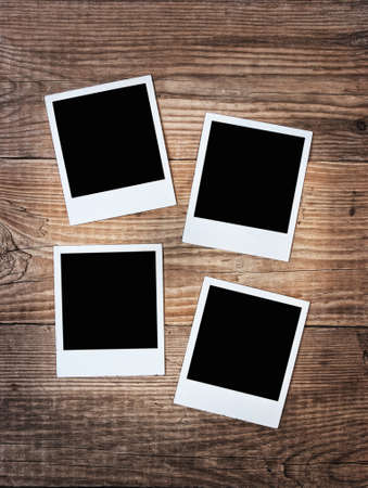 old photos on wooden wall の写真素材