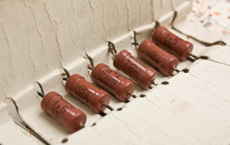 Old electronic components lie on the wiring diagram