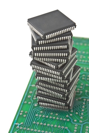 pile of microchips on a printed circuit board isolated on white backgroundの写真素材