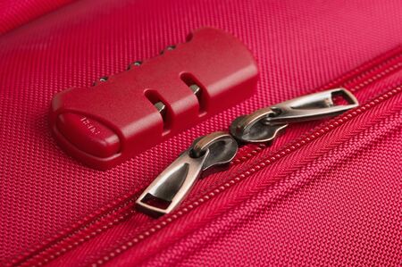 combination lock on a pink suitcase travel