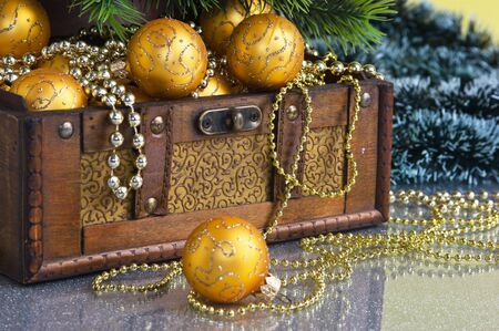 Christmas decoration in chest on Christmas background の写真素材