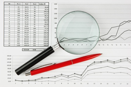 magnifying glass and working paper with  diagram の写真素材