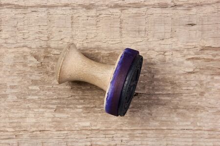 Old  stamp on a wooden tableの写真素材