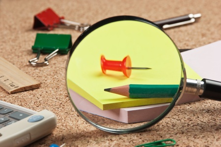 stationery in a mess on the tableの写真素材