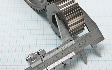 gears and caliper on graph paperの写真素材