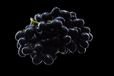 bunch of grapes isolated on black backgroundの写真素材
