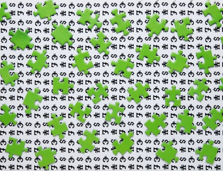 green puzzles and symbols of moneyの写真素材