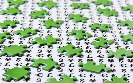 green puzzles and symbols of moneyの写真素材