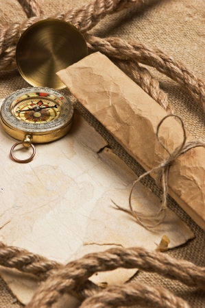 old paper with compass and rope on canvasの写真素材