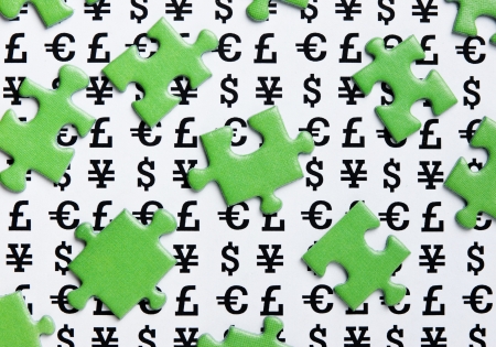 green puzzles and symbols of moneyの写真素材