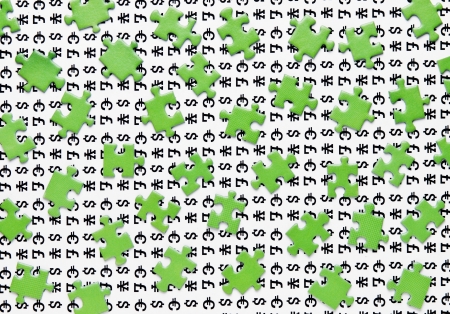 green puzzles and symbols of moneyの写真素材