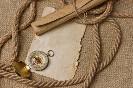 old paper with compass and rope on canvasの写真素材