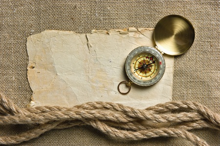 Vintage background with old paper and compass