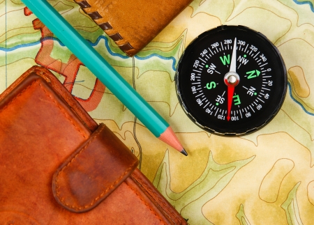 compass wallet and passport on the old mapの写真素材