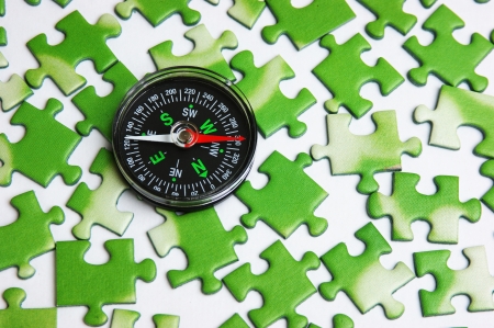 compass on the green puzzleの写真素材