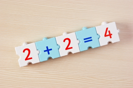 School cubes with math problems on the table