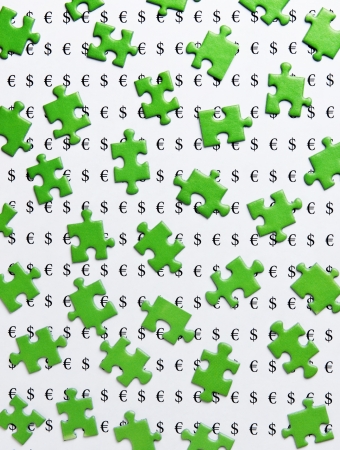 green puzzles and symbols of moneyの写真素材