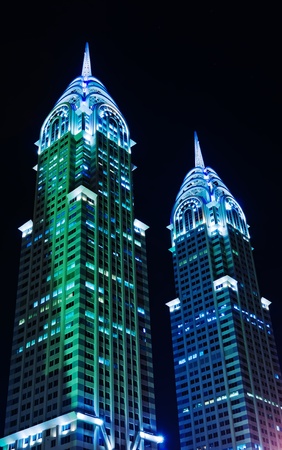 DUBAI, UAE-NOVEMBER 14: Night view of the Chrysler building in Dubai on November 14, 2012. Two imitations of NYC Chrysler building.のeditorial素材