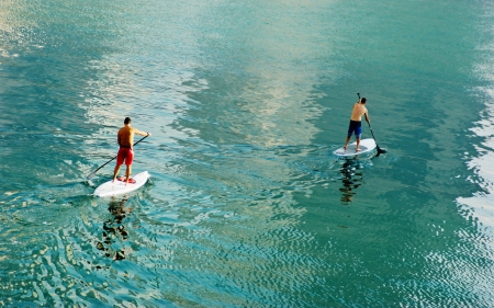 Two surfer in calm waterの写真素材
