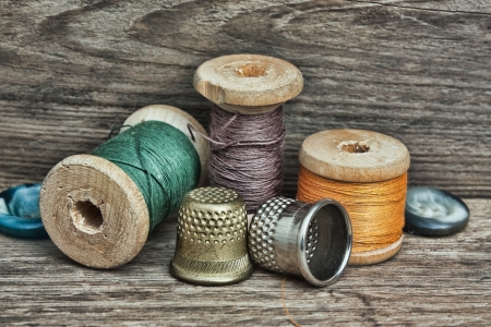 still life of spools of thread on a wooden backgroundの写真素材