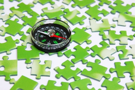 compass on the green puzzleの写真素材
