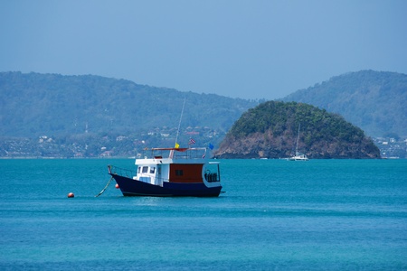 new boat diver is anchored in the seaの写真素材