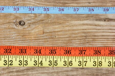 sartorial meter on the old wooden background