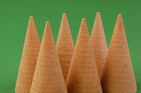 wooden geometric shapes on a green backgroundの写真素材