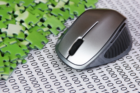 computer mouse and  puzzles on a binary codeの写真素材