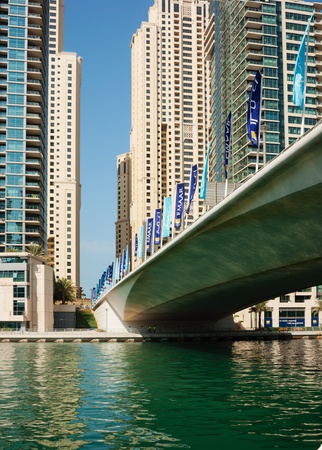 DUBAI, UAE - NOVEMBER 16: Bridge on the Gulf in Dubai Marina nov 16. 2012 in Dubai, UAE. In the city of artificial channel length of 3 kilometers along the Persian Gulf.のeditorial素材