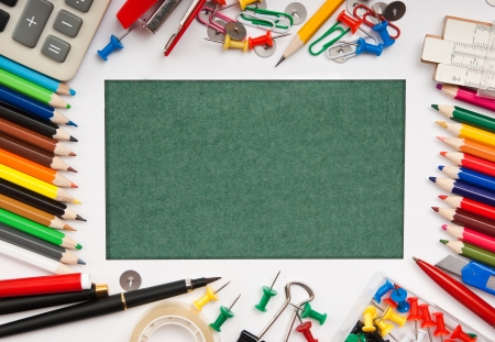 frame from a variety of office supplies and green paper for notesの写真素材