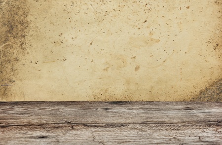 Old wooden deck table with vintage grunge backgroundの写真素材