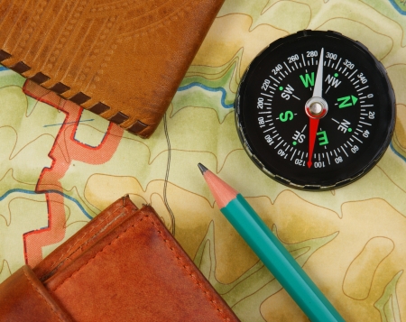 compass wallet and passport on the old mapの写真素材
