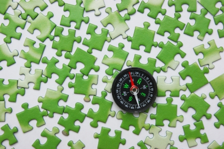compass on the green puzzleの写真素材