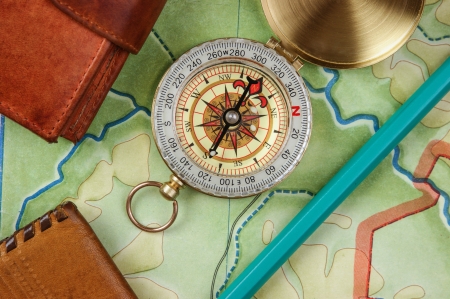 compass wallet and passport on the old mapの写真素材
