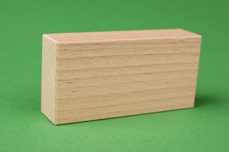 wooden geometric shapes on a green backgroundの写真素材