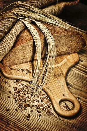 rye bread, and corn on the wooden tableの写真素材