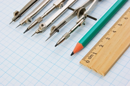 Old drawing tools on graph paper