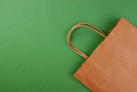 paper bag on a green backgroundの写真素材