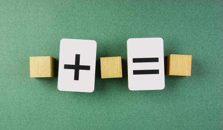 wooden cube and school card with math problemsの写真素材