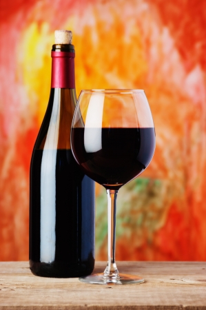 bottle and glass of red wineの写真素材