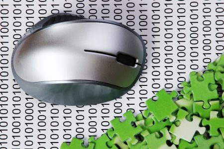 computer mouse and  puzzles on a binary codeの写真素材