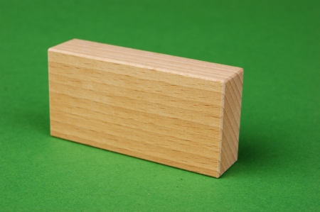 wooden geometric shapes on a green backgroundの写真素材