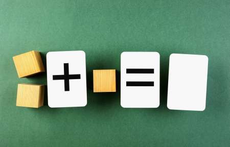 wooden cube and school card with math problemsの写真素材