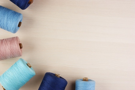 bobbin with thread on the tableの写真素材